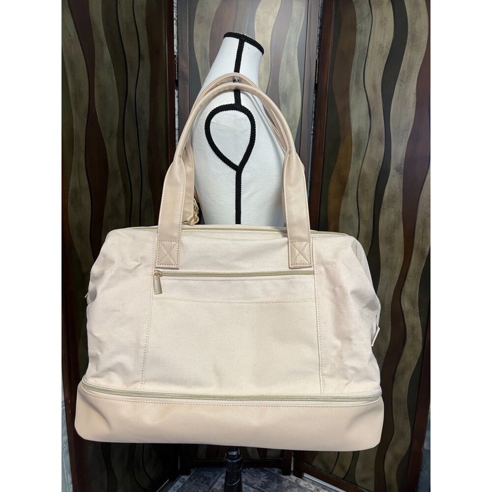 Members Mark canvas weekender bag in off-white.